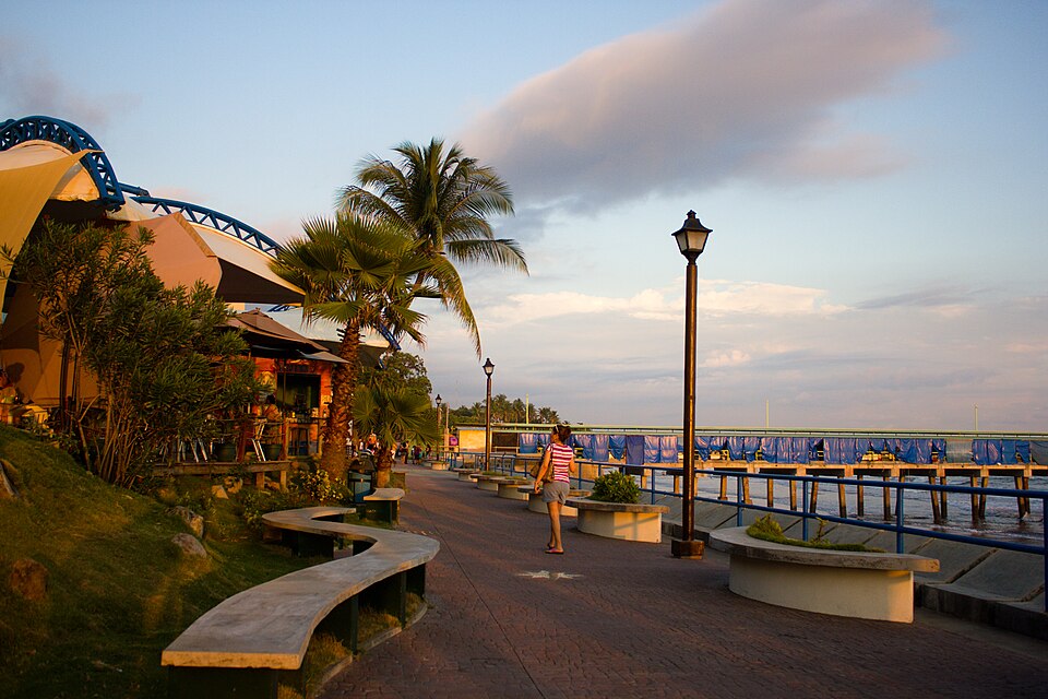 Waterfront and pier of Puerto de La Libertad at sunset